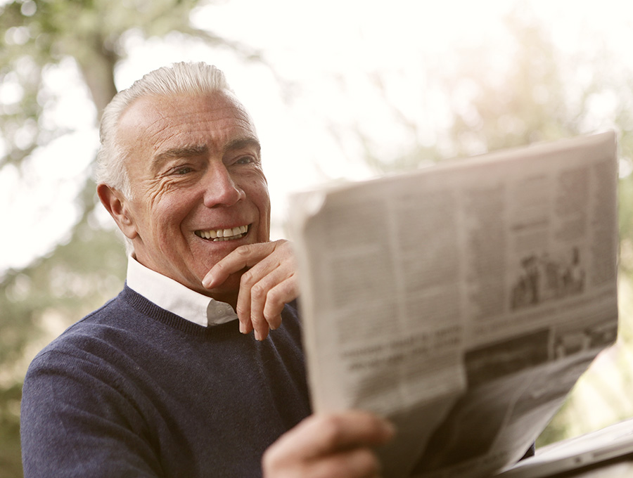 Senior reading a newspaper